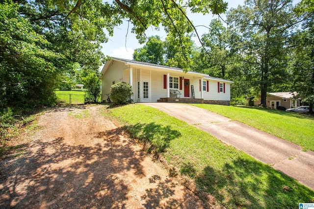 76 Pine Tree Ln, Alexandria, AL 36250 - ranch-style house featuring driveway and a porch