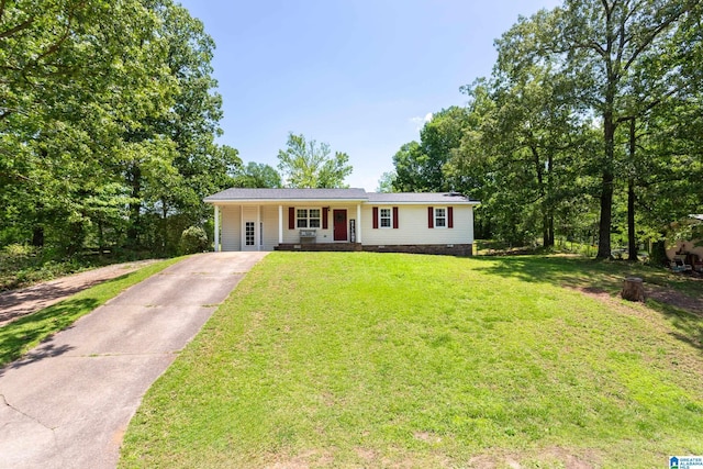 76 Pine Tree Ln, Alexandria, AL 36250 - ranch-style house featuring driveway, a front yard, and covered porch