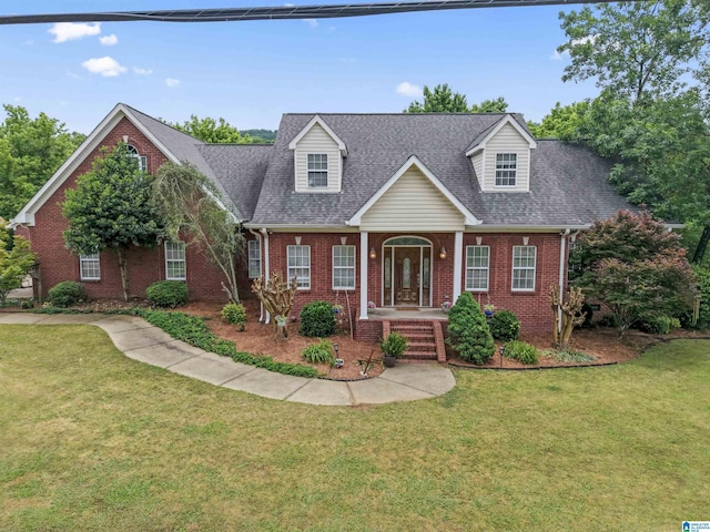 13688 Remlap Dr, Remlap, AL 35133 - new england style home with brick siding, a porch, a front lawn, and roof with shingles