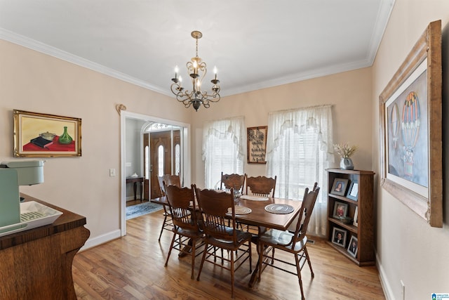 13688 Remlap Dr, Remlap, AL 35133 - dining room with a chandelier, light wood finished floors, ornamental molding, and baseboards