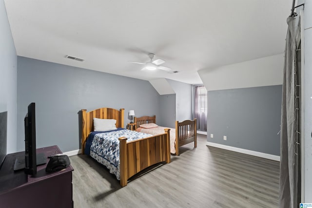 13688 Remlap Dr, Remlap, AL 35133 - bedroom featuring wood finished floors, baseboards, lofted ceiling, and a ceiling fan