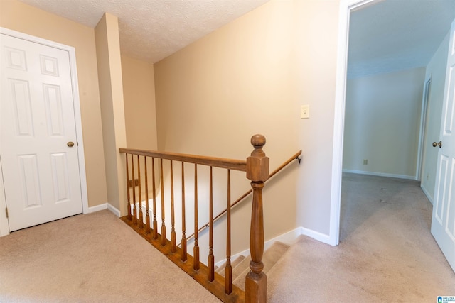 994 Comanche Trl, Anniston, AL 36206 - hall with an upstairs landing, carpet floors, and baseboards