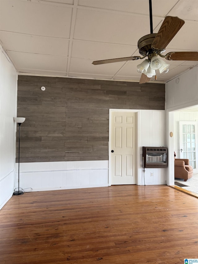 829 Higgs Dr, Adger, AL 35006 - unfurnished room with wooden walls, ceiling fan, wood finished floors, and heating unit