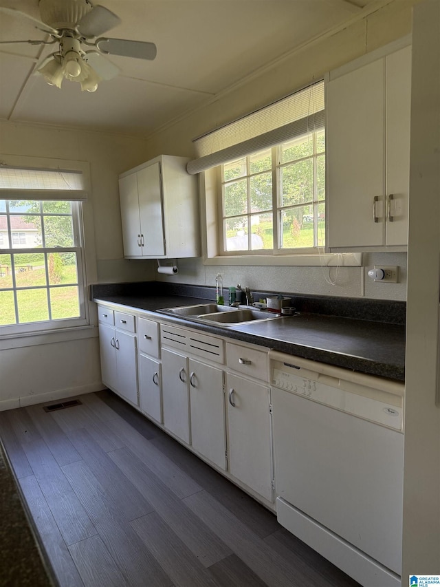 829 Higgs Dr, Adger, AL 35006 - kitchen with white dishwasher, a sink, dark countertops, and white cabinetry