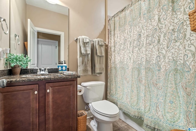 bathroom featuring toilet, tile patterned flooring, vanity, and a shower with shower curtain