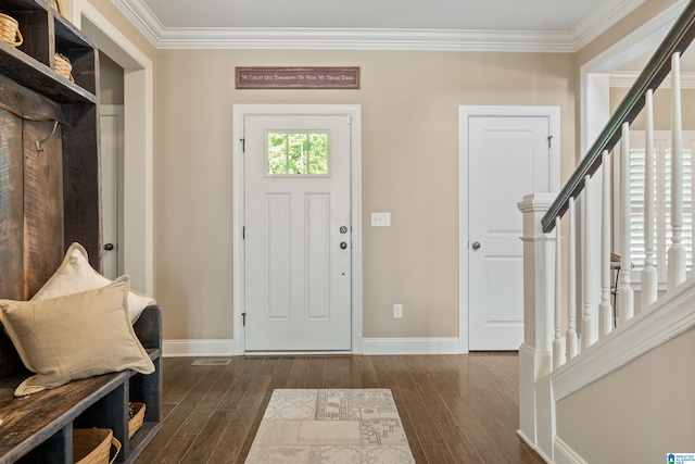 entrance foyer with dark wood-style flooring, crown molding, stairs, and baseboards