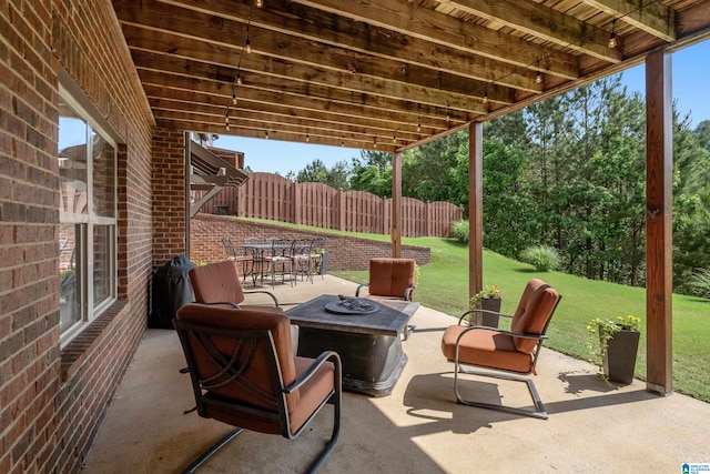view of patio with a fire pit