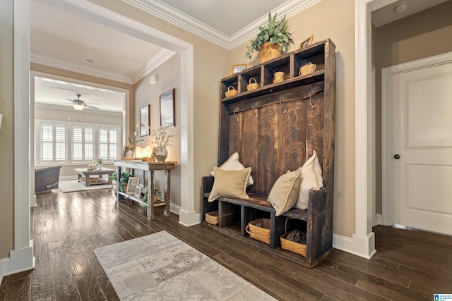 mudroom featuring ceiling fan, crown molding, dark wood-style floors, and baseboards