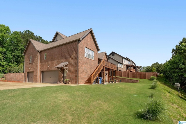 view of home's exterior featuring a garage, stairway, brick siding, concrete driveway, and a deck