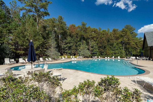 community pool featuring a patio area