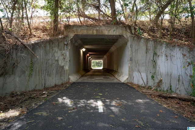 view of outbuilding with asphalt driveway