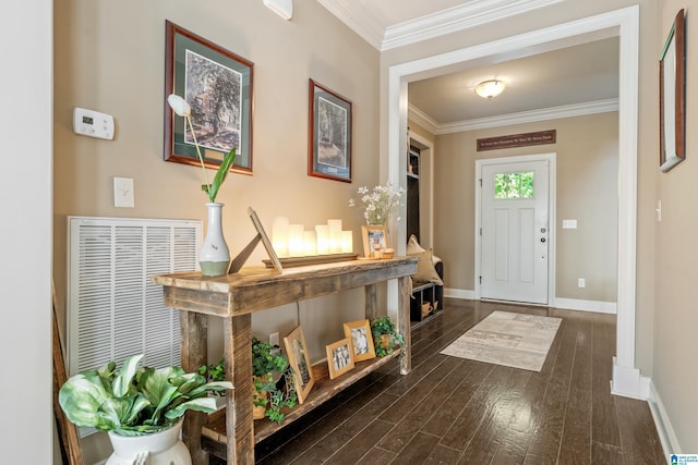 entryway with crown molding, baseboards, and dark wood-type flooring