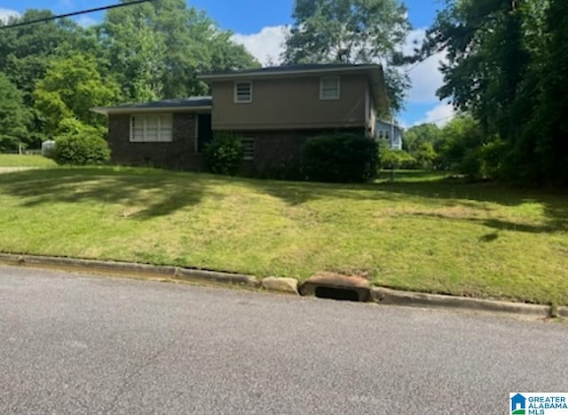906 30th St, Phenix City, AL 36867 - tri-level home featuring a front yard