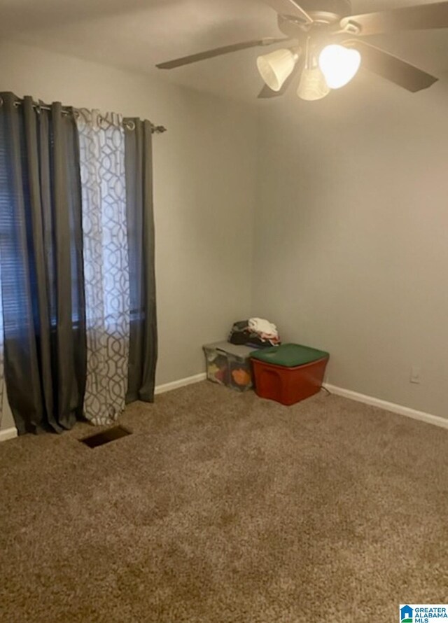 906 30th St, Phenix City, AL 36867 - carpeted spare room with ceiling fan and baseboards