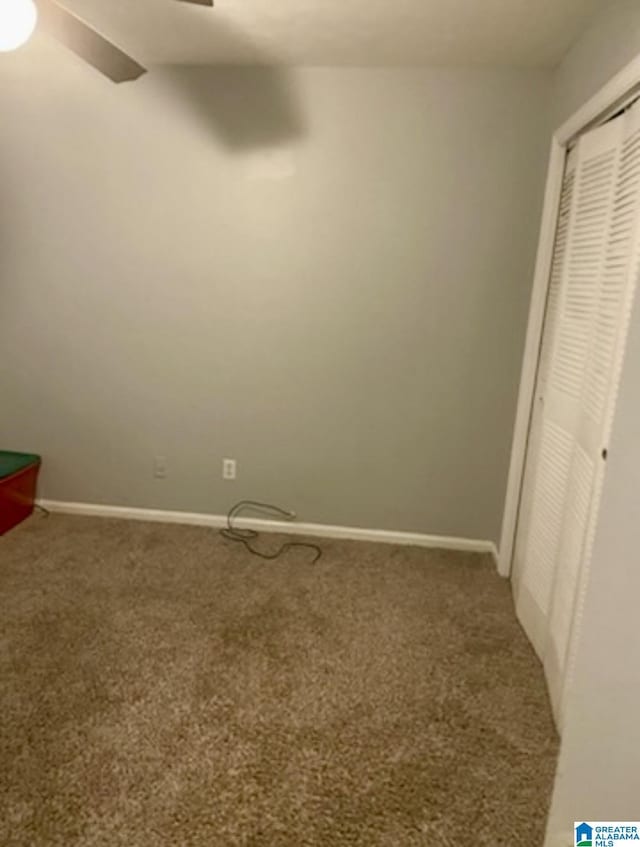 906 30th St, Phenix City, AL 36867 - unfurnished bedroom featuring carpet, baseboards, a closet, and ceiling fan