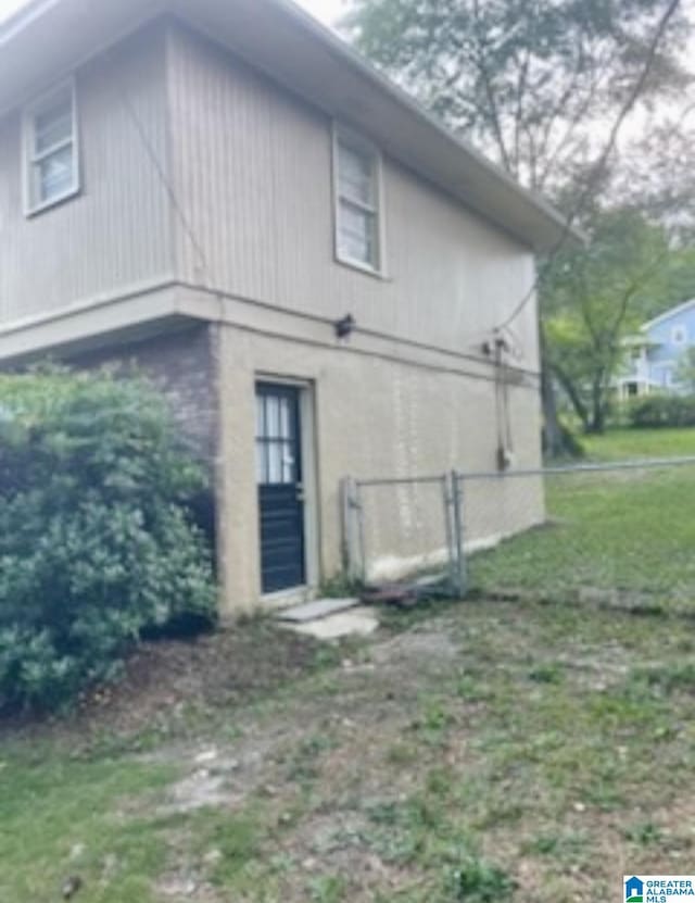 906 30th St, Phenix City, AL 36867 - view of side of home featuring fence