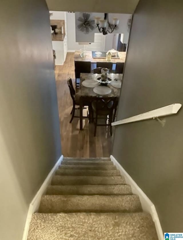906 30th St, Phenix City, AL 36867 - stairway with wood finished floors and baseboards