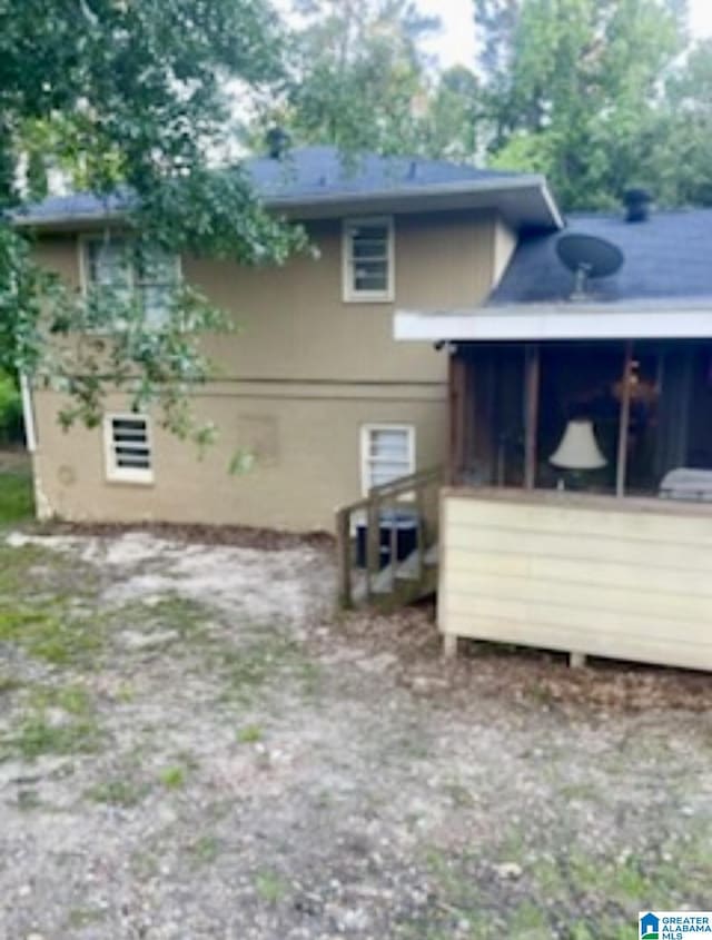 906 30th St, Phenix City, AL 36867 - view of side of property featuring a sunroom