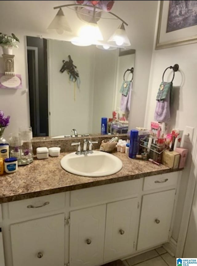 906 30th St, Phenix City, AL 36867 - bathroom with vanity and tile patterned floors