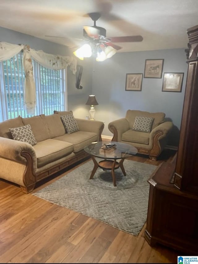 906 30th St, Phenix City, AL 36867 - living room with a ceiling fan and wood finished floors