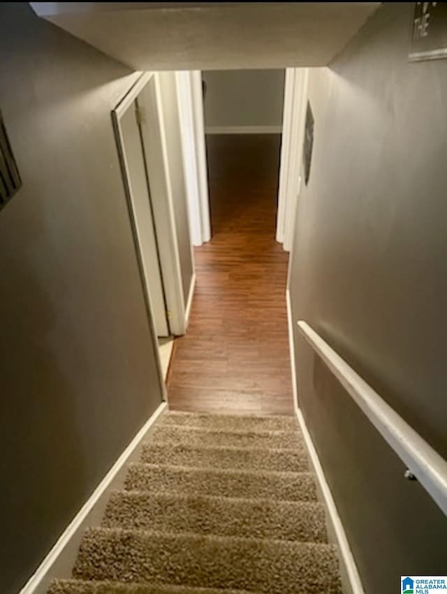906 30th St, Phenix City, AL 36867 - stairs featuring wood finished floors and baseboards