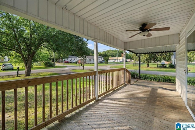 401 W 3rd Ave, Oneonta, AL 35121 - wooden porch with ceiling fan, a yard, and a residential view