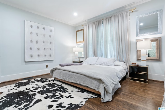 bedroom with ornamental molding, baseboards, dark wood-type flooring, recessed lighting, and multiple windows