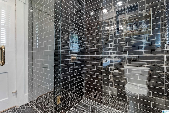 bathroom with a tile shower