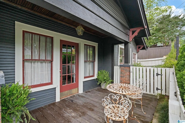 wooden terrace with a porch