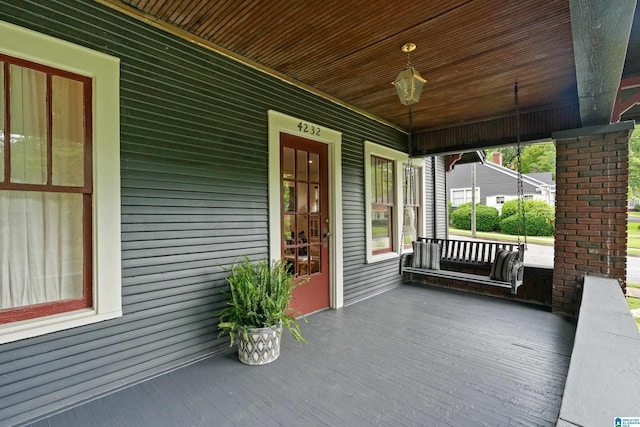 wooden deck featuring covered porch