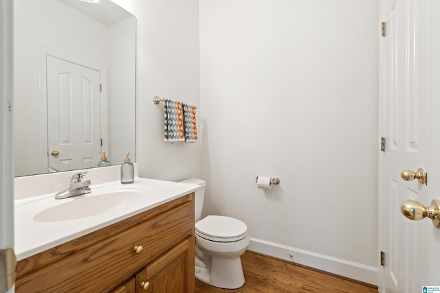175 Sunhill Rd, Remlap, AL 35133 - half bath with baseboards, wood finished floors, toilet, and vanity