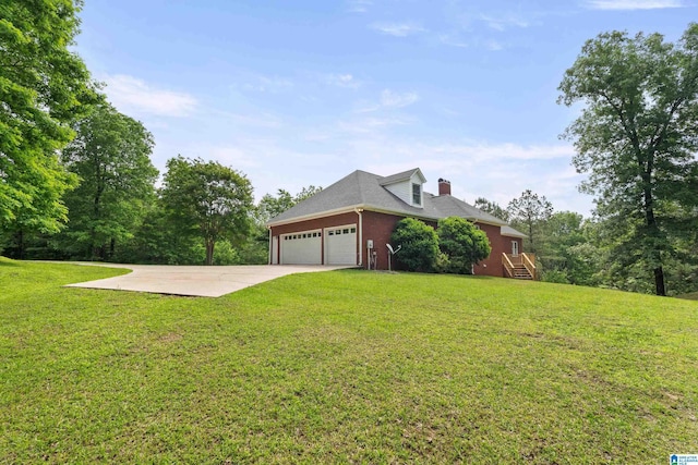 175 Sunhill Rd, Remlap, AL 35133 - view of home's exterior featuring a yard, a garage, concrete driveway, and a chimney