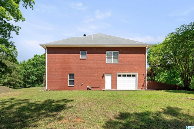 175 Sunhill Rd, Remlap, AL 35133 - back of property featuring a lawn, brick siding, roof with shingles, and an attached garage