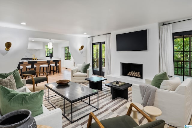 3400 Autumn Haze Ln, Birmingham, AL 35242 - living area with healthy amount of natural light, a fireplace, recessed lighting, and light wood-style flooring