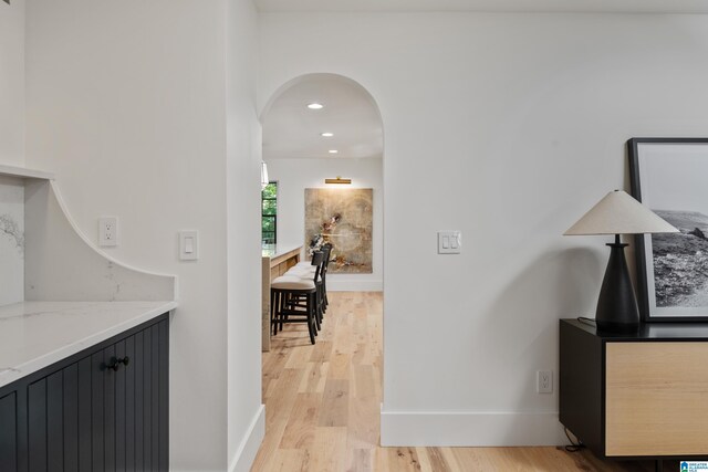 3400 Autumn Haze Ln, Birmingham, AL 35242 - hallway with arched walkways, light wood finished floors, baseboards, and recessed lighting