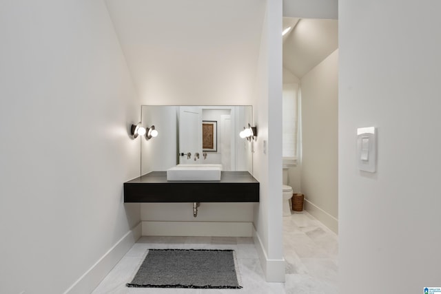3400 Autumn Haze Ln, Birmingham, AL 35242 - bathroom featuring a sink, toilet, baseboards, and lofted ceiling