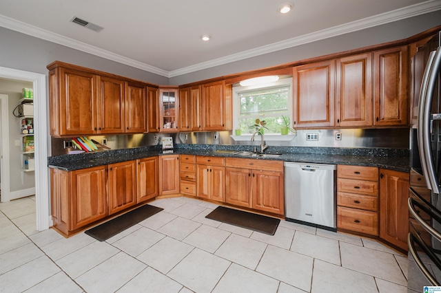 327 Ridgeview Lake Rd, Alabaster, AL 35007 - kitchen featuring stainless steel appliances, a sink, brown cabinetry, crown molding, and light tile patterned floors