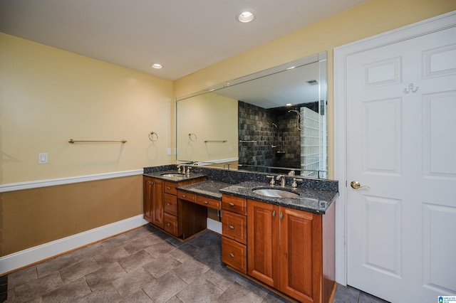 327 Ridgeview Lake Rd, Alabaster, AL 35007 - bathroom with baseboards, a tile shower, and double vanity