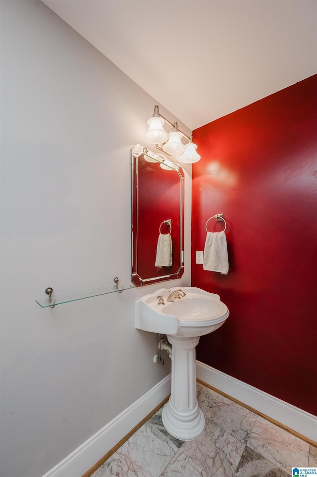 327 Ridgeview Lake Rd, Alabaster, AL 35007 - bathroom with marble look tile flooring and baseboards