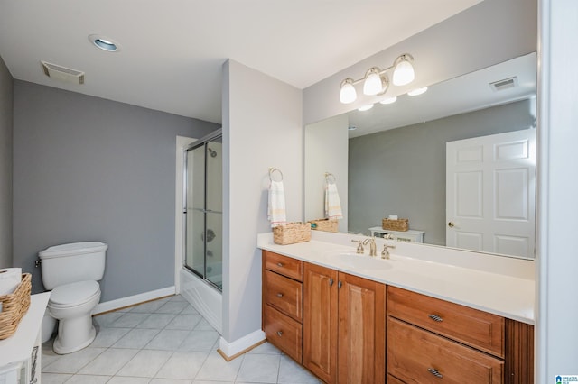 327 Ridgeview Lake Rd, Alabaster, AL 35007 - full bathroom with toilet, vanity, tile patterned flooring, bath / shower combo with glass door, and baseboards