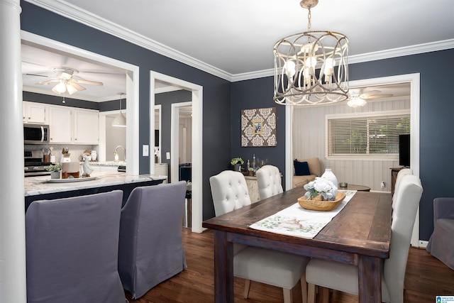 734 Crest Ln, Homewood, AL 35209 - dining room featuring a ceiling fan, a chandelier, crown molding, and dark wood-type flooring