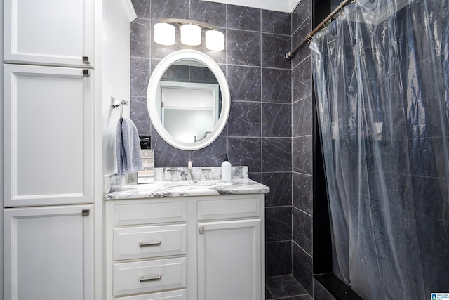 734 Crest Ln, Homewood, AL 35209 - full bathroom with tile walls, vanity, and tiled shower