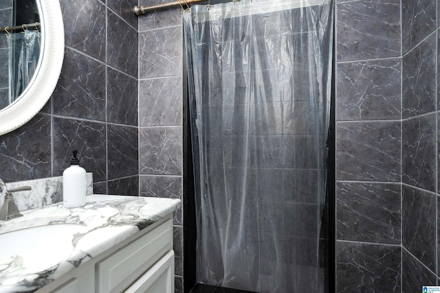 734 Crest Ln, Homewood, AL 35209 - bathroom featuring vanity, a shower with curtain, and tile walls