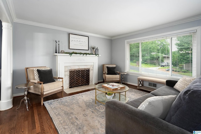 734 Crest Ln, Homewood, AL 35209 - living area featuring wood finished floors, crown molding, a premium fireplace, baseboards, and decorative columns