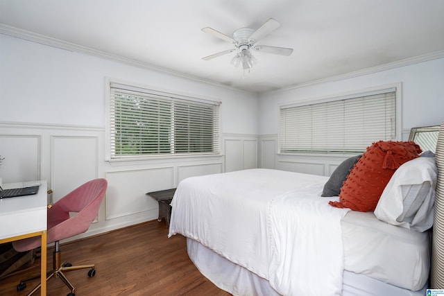 734 Crest Ln, Homewood, AL 35209 - bedroom with wood finished floors, crown molding, a wainscoted wall, a decorative wall, and ceiling fan