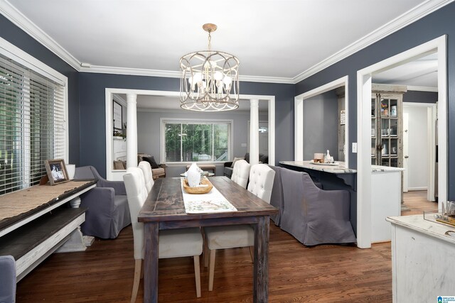 734 Crest Ln, Homewood, AL 35209 - dining room with a chandelier, wood finished floors, ornamental molding, and ornate columns