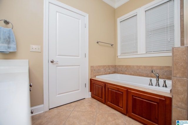 bathroom featuring a bath, ornamental molding, and tile patterned floors