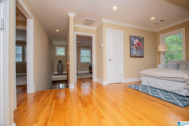 bedroom featuring crown molding, wood finished floors, baseboards, and recessed lighting