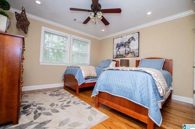 bedroom featuring baseboards, wood finished floors, recessed lighting, ornamental molding, and ceiling fan