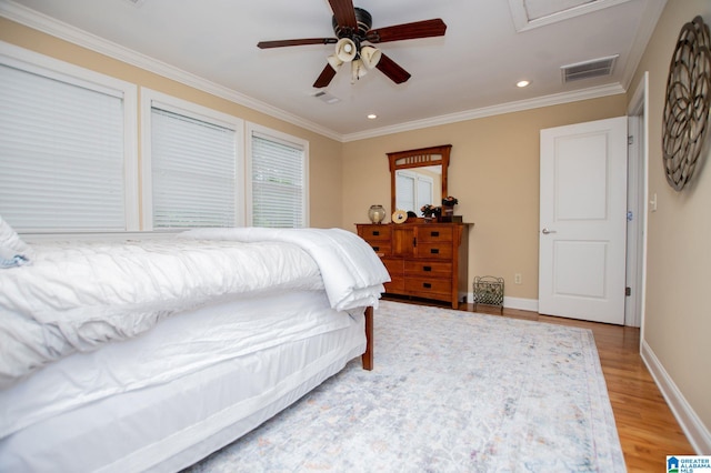 bedroom featuring light wood-style floors, recessed lighting, ornamental molding, baseboards, and ceiling fan